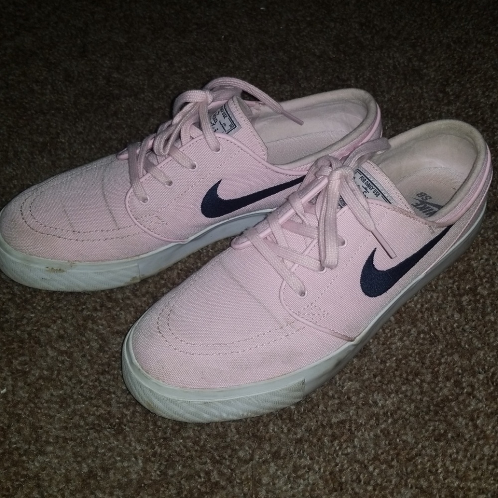 Pink colored Nike Janoski sneakers.
